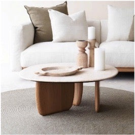 Wooden coffee table with decorative items in a living room setting