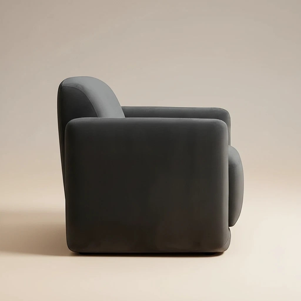 Trộm vía Fallon accent chair in shadow grey, upholstered in soft fabric with rounded arms and a plush seat.